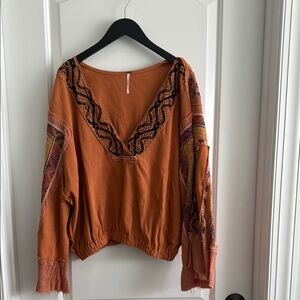 We The Free Orange Ruffled Blouse with V-Neck and Long Sleeves